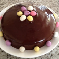 Decorating a chocolate cake for Easter Cake